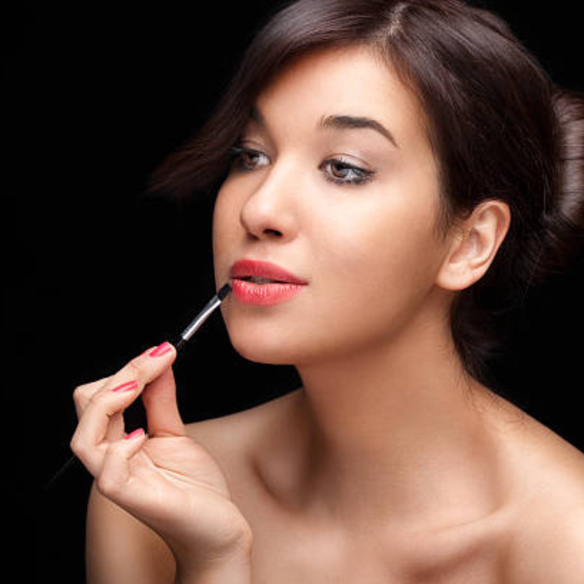 woman applying lip liner