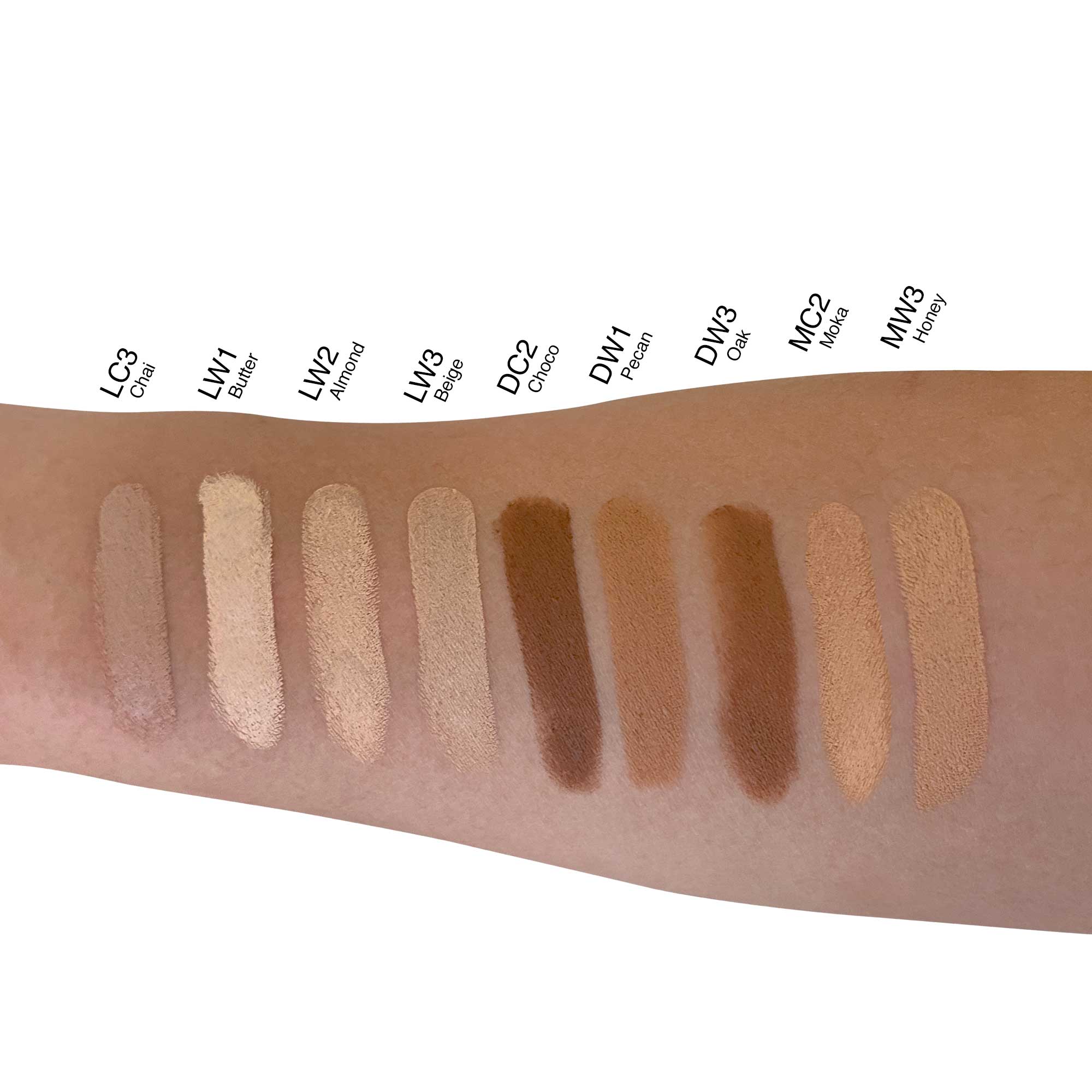 Creme Concealer Stick - Almond Glow swatched on arm, showcasing its medium to full coverage for blemishes and contouring. Compact, recyclable packaging ideal for on-the-go use.