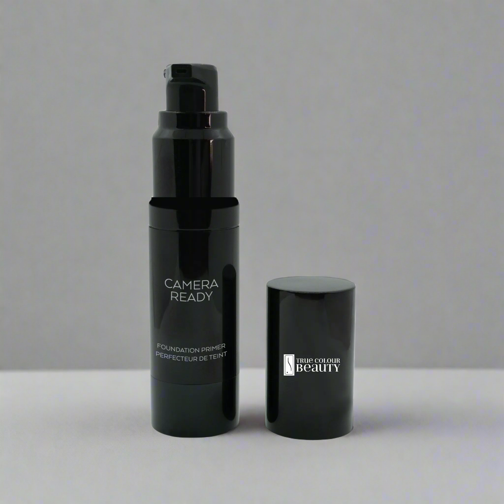 Studio Camera Ready Foundation Primer in a sleek black bottle with a cap, designed to prep skin for a flawless, camera-ready finish.