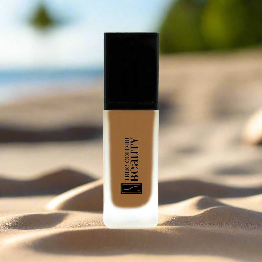 Earthbound Liquid Foundation - Maplewood bottle close-up, showcasing its sleek design and recyclable packaging, embodying TCBeauty's commitment to sustainable, cruelty-free, vegan makeup.