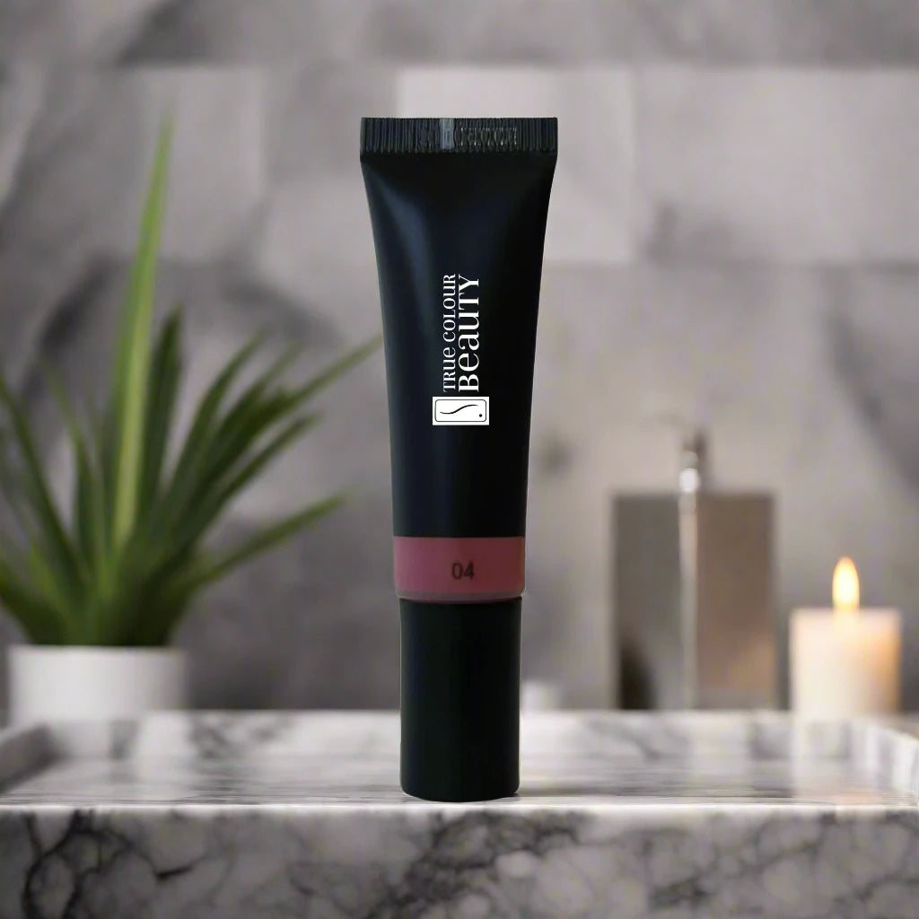 A tube of liquid blush on a luxury marble counter top