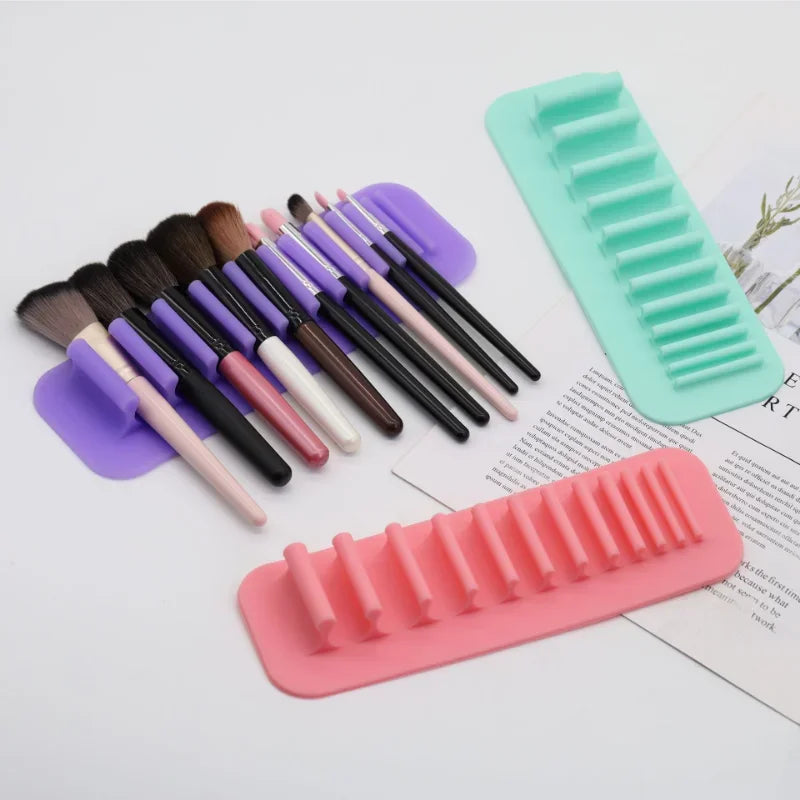 Wall-Mounted Silicone Makeup Brush Holder showcasing various brushes in a sleek, space-saving design, highlighting its 11-hole capacity for organized, hygienic storage.