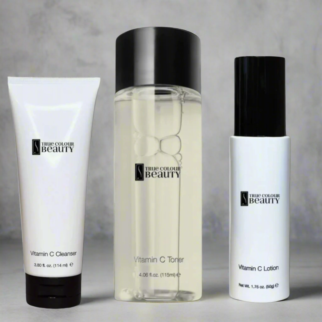 Vitamin C Skincare Bundle with lotion, toner, and cleanser in white bottles, enhancing skin's radiance and hydration.