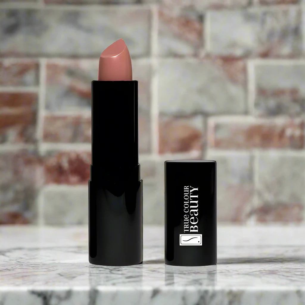 Soft Mocha lipstick placed on a marble counter, highlighting its soft brown color